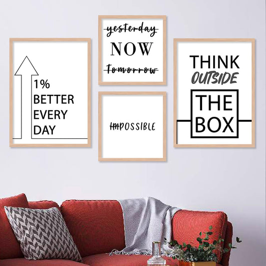 A 4-piece motivational wall frame set with black and white typography, including phrases like "Think Outside the Box," "1% Better Every Day," "Now," and "Impossible" with 'Im' crossed out.