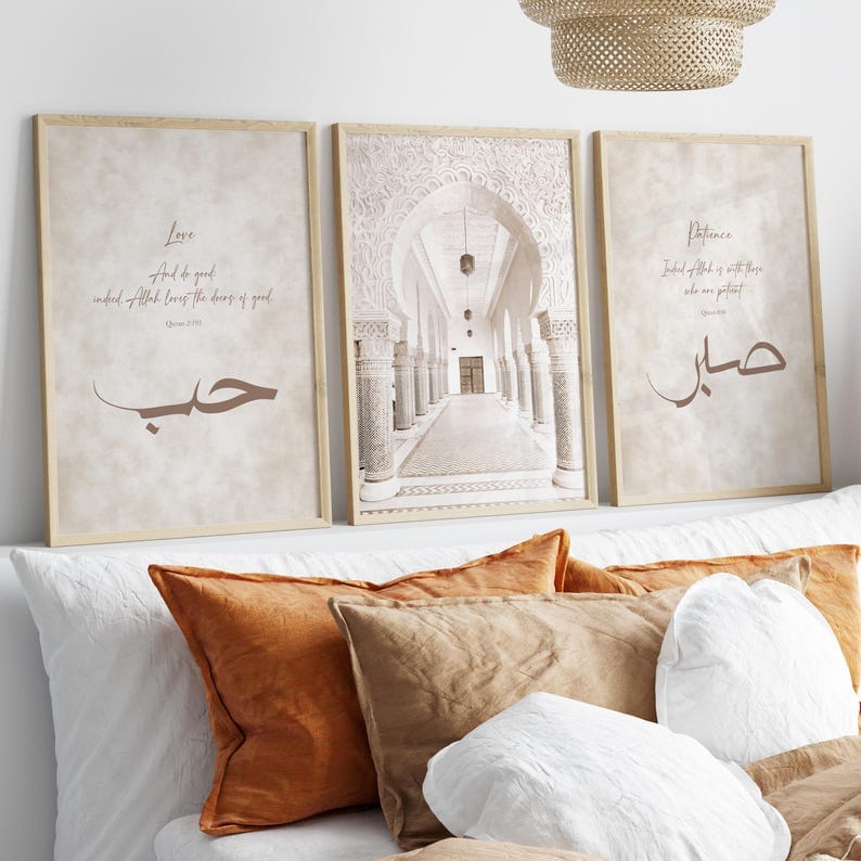 Decorative pillows on a sofa with framed artwork on the wall.