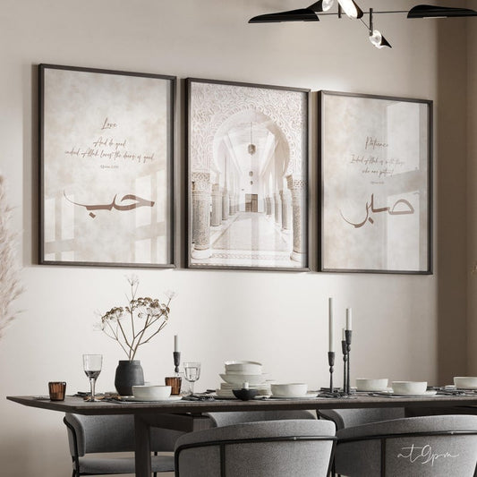 Dining room with framed artwork on the wall and a set dining table.